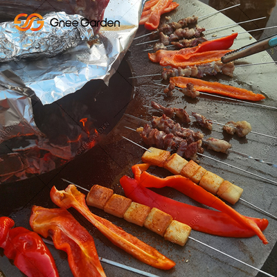 まきの貯蔵の裏庭の錆ついた色の屋外BBQ Cortenの鋼鉄火ピット