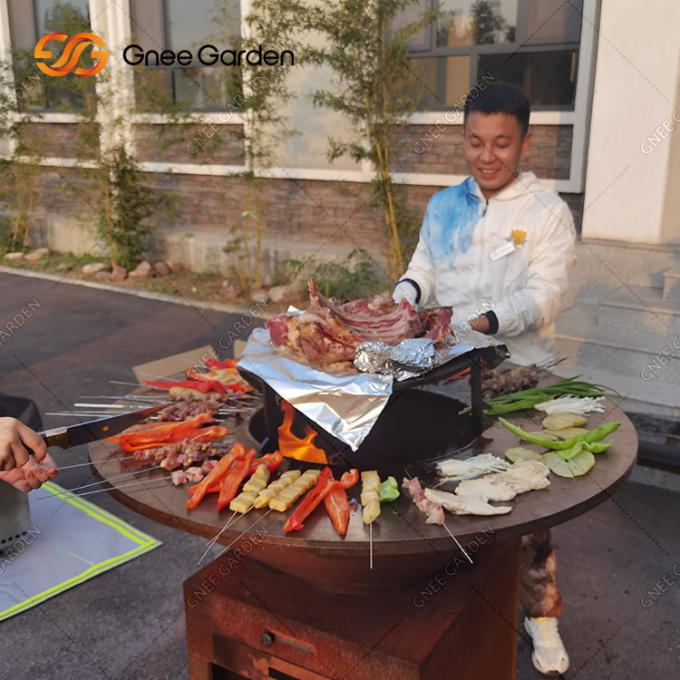 グリルの屋外の庭の錆のCortenの鋼鉄火ピットBBQを調理して包装サービスを焼きなさい
