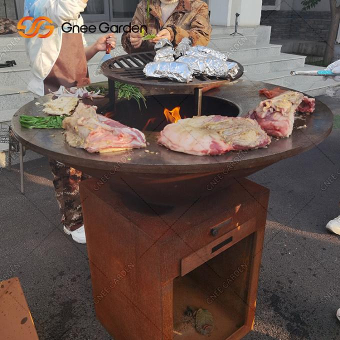 グリルの屋外の庭の錆のCortenの鋼鉄火ピットBBQを調理して包装サービスを焼きなさい